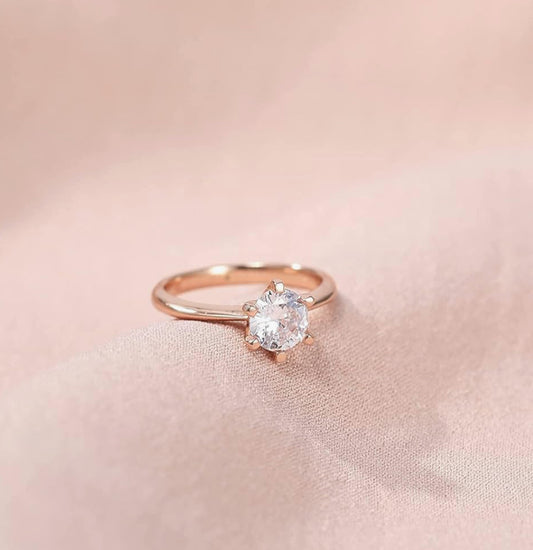Bague or rose solitaire